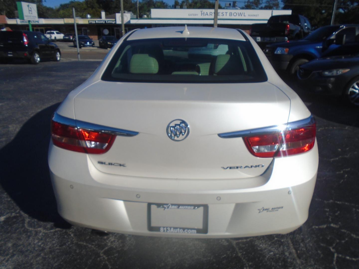 2012 White /Tan Buick Verano Convenience (1G4PR5SK6C4) with an 2.4L L4 DOHC 16V FFV engine, 6-Speed Automatic transmission, located at 6112 N Florida Avenue, Tampa, FL, 33604, (888) 521-5131, 27.954929, -82.459534 - Photo#4